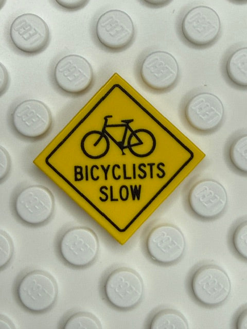 Warning Sign 2x2 Tile: Bicyclists Slow Sign