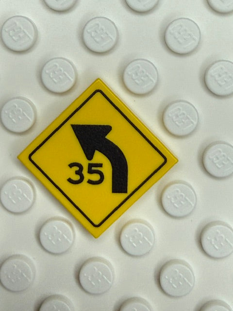Warning Sign 2x2 Tile: Left Combo Curve Speed Sign